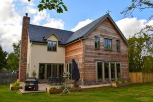 External view of a self build home utilising SIPs on an oak frame