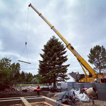 The Gables – SIP Self Build – SIP Build UK- clients image 5 – Block and Beam going in SIP panels being craned into position using HIAB during efficient offsite construction on a tight-access site.